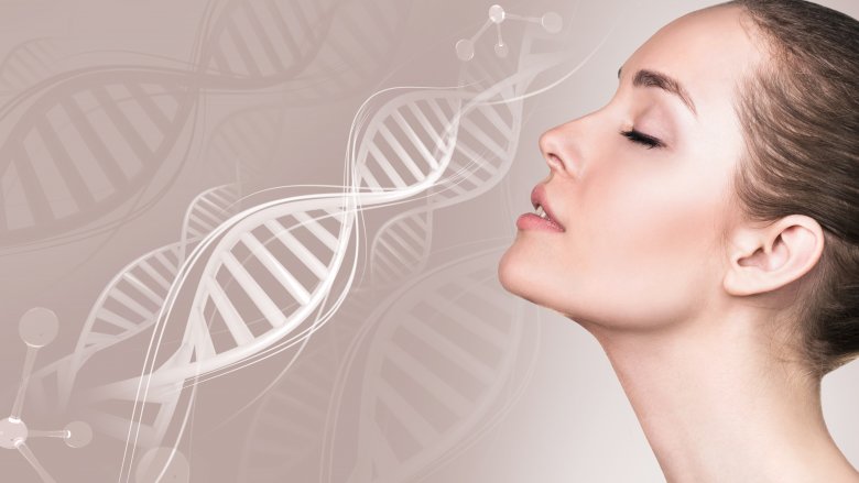woman with head back and eyes closed by image of DNA