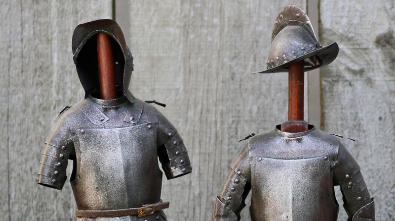 Suits of armor on wooden poles