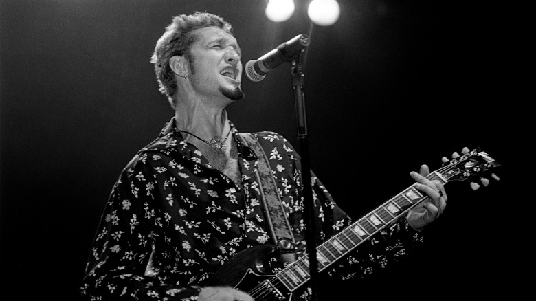 Layne Staley on stage with guitar