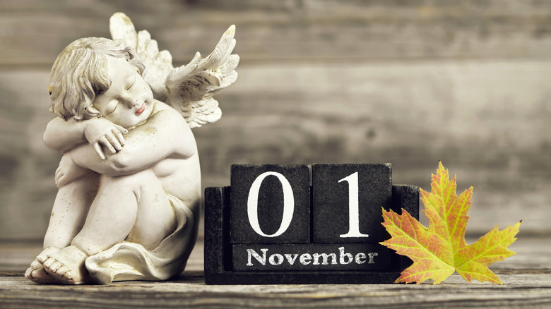 Angel statue with calendar reading November 1