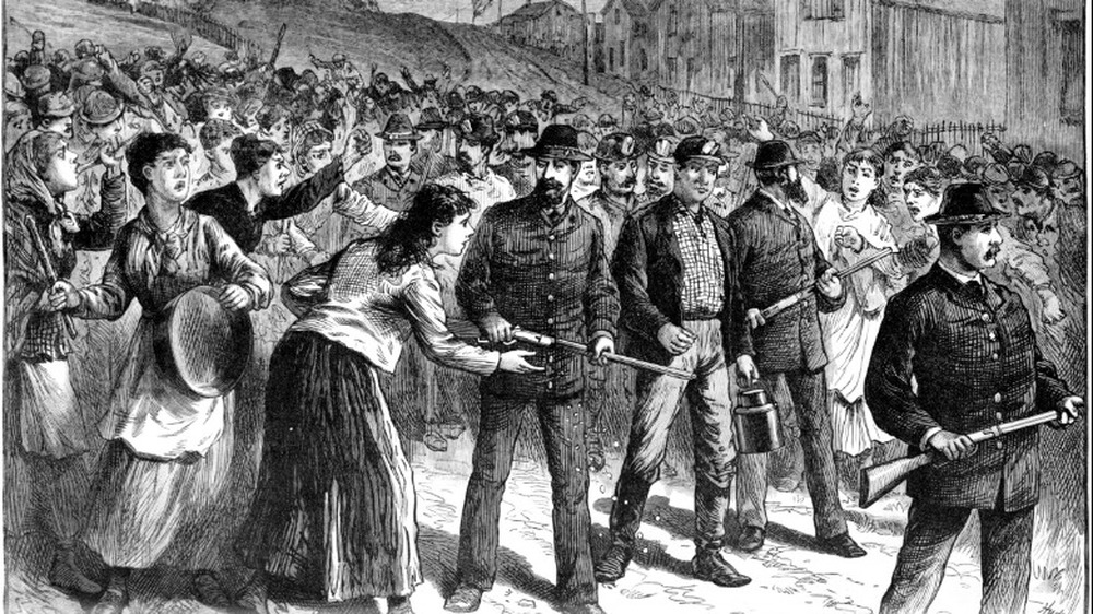 Pinkerton guards escort strikebreakers 