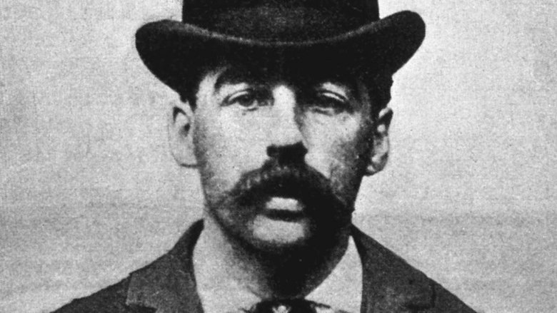 HH Holmes wearing hat