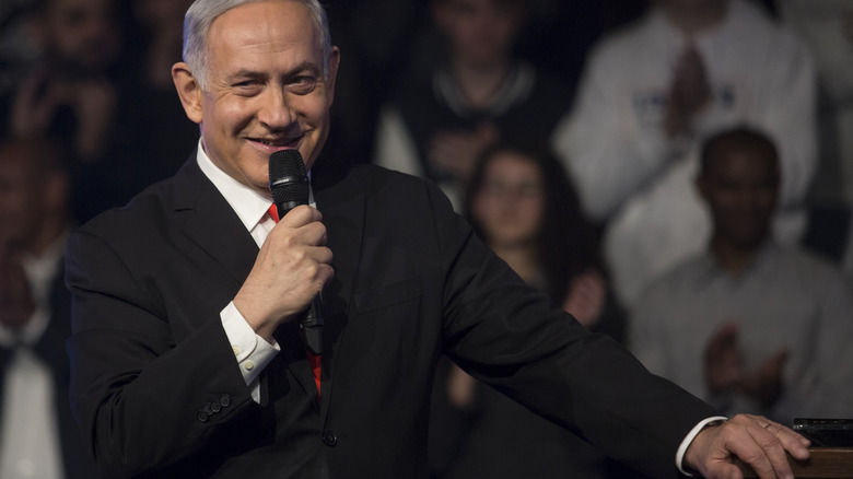 Benjamin Netanyahu smiling at a speech