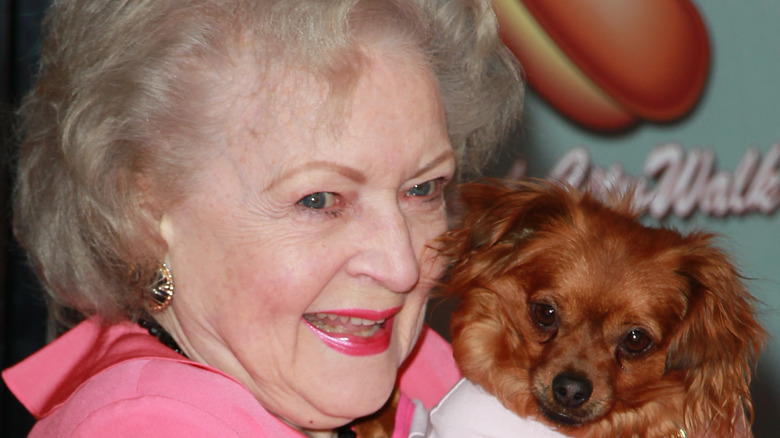 Actress Betty White with a dog
