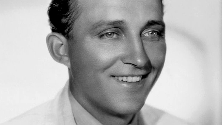 Bing Crosby grinning in white suit