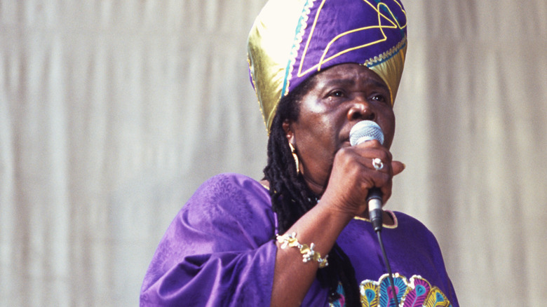 Cedella Marley Booker holding a microphone onstage