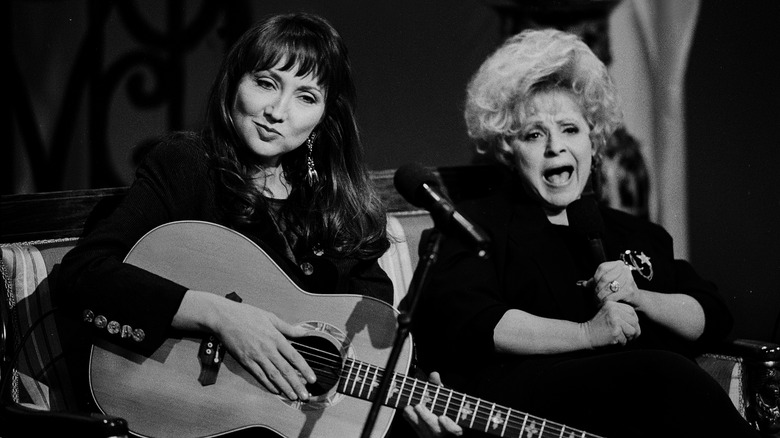 brenda lee and pam tillis performing on stage