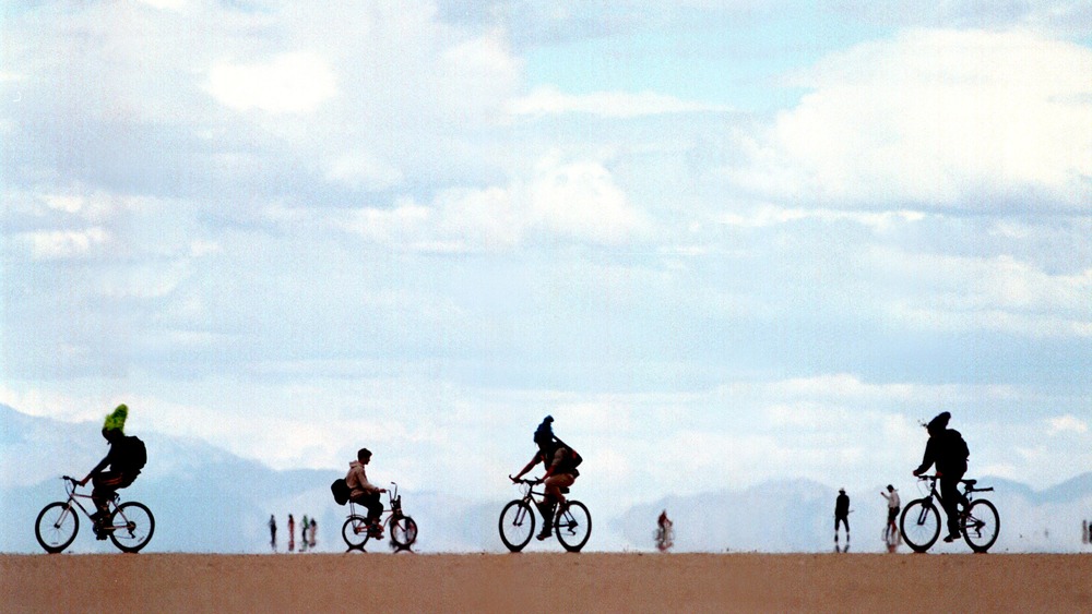 Festival-goers on bicycles 