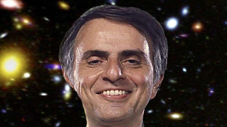 Carl Sagan smiling stars background