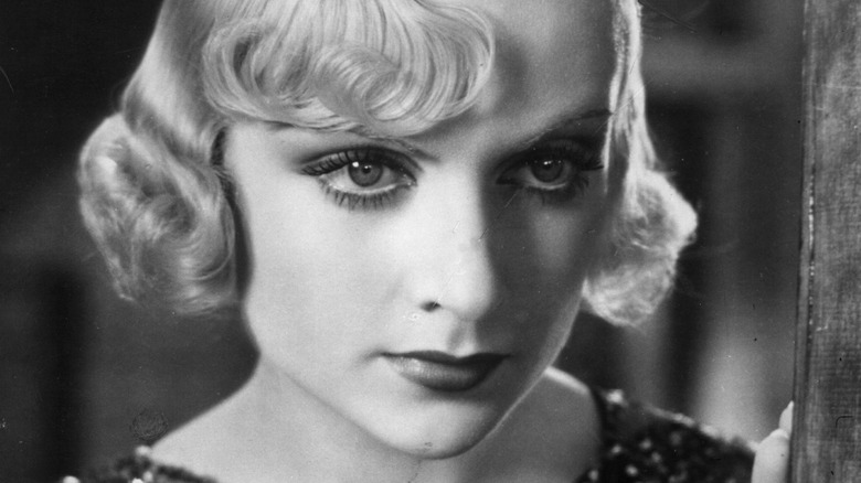 Carole Lombard looking away