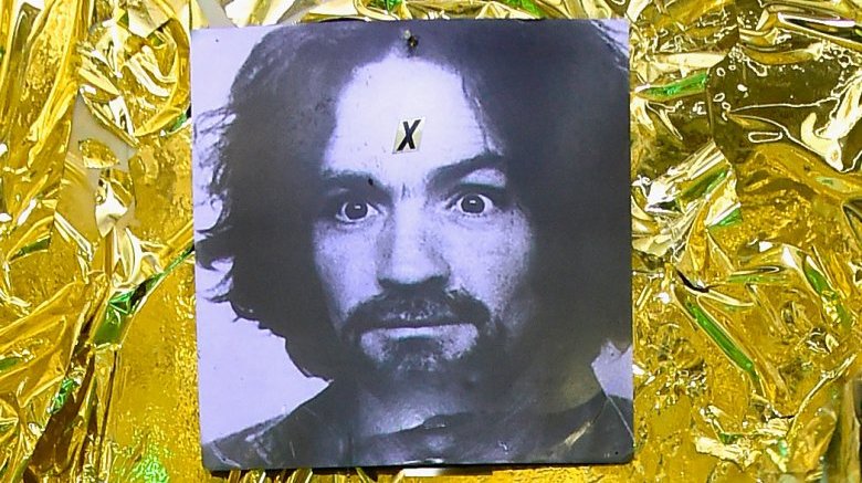 charles manson poster gold background