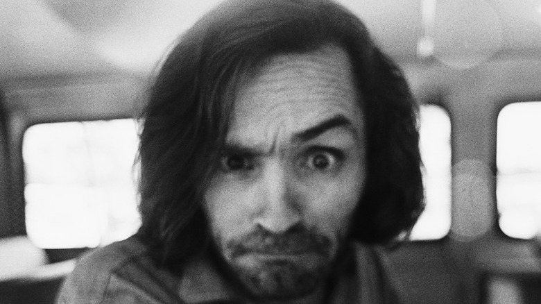 Charles Manson with eyebrow raised