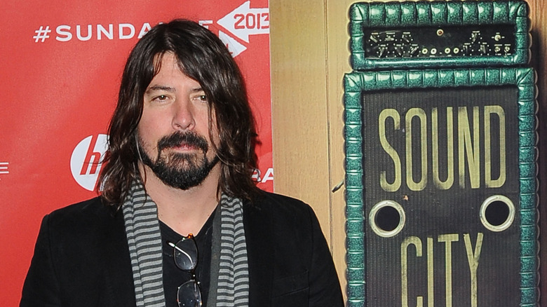 Dave Grohl in black jacket and scarf at Sound City event