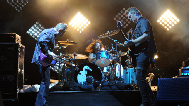 Dave Grohl drumming with Them Crooked Vultures on stage