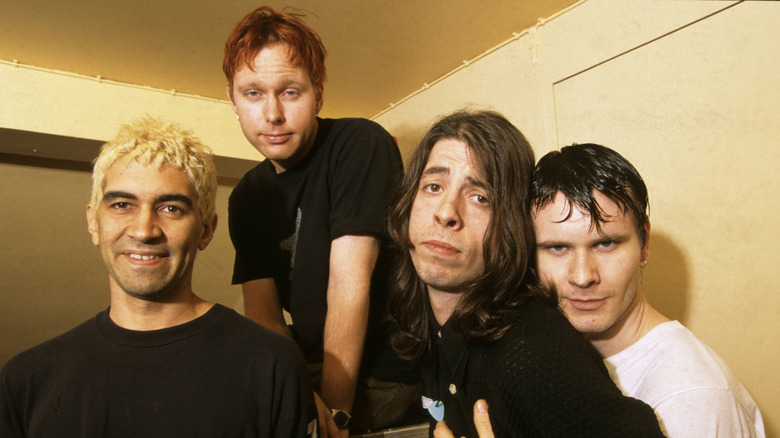 foo fighters original line up in small room together
