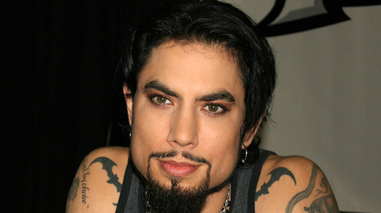 Dave Navarro sitting at a signing