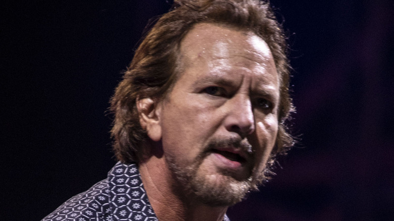 Eddie Vedder looking to camera black background