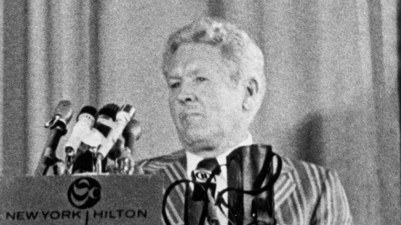 Vernon Presley frowning at press conference