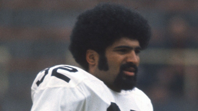 Franco Harris wearing white jersey