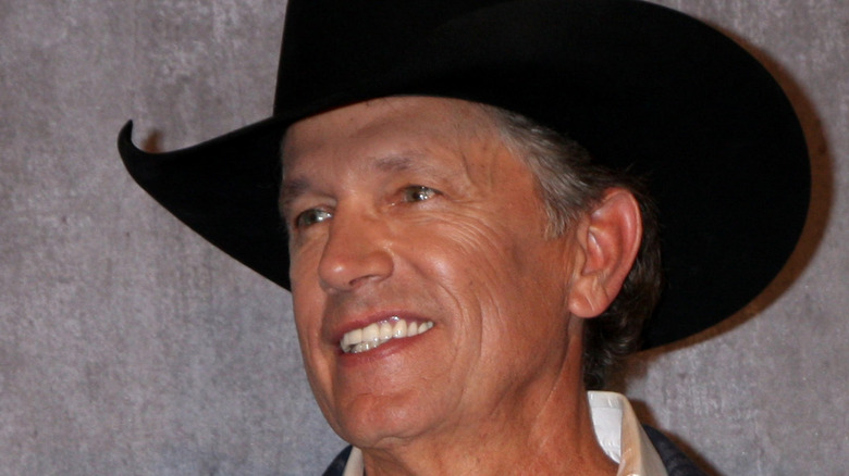 George Strait with award.