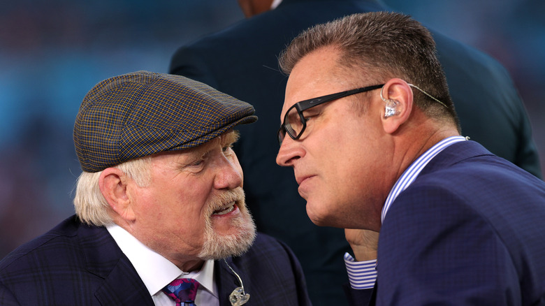 Terry Bradshaw (left) speaking to Long