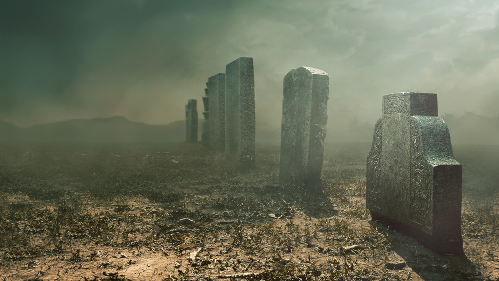 tombstones under fog