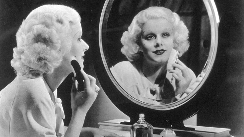 Jean Harlow putting makeup on
