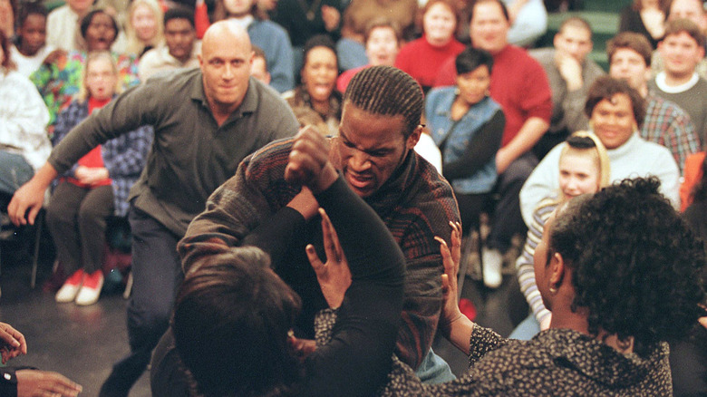 men fighting crowd
