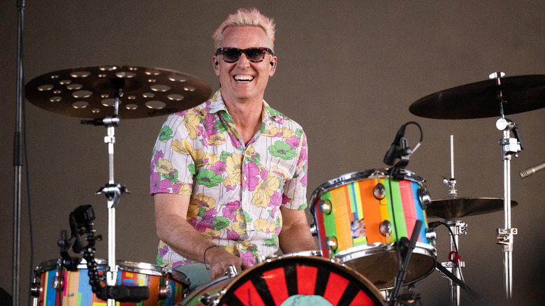 Josh Freese grinning behind drum kit