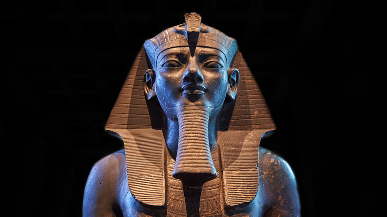 Amenhotep III statue black background