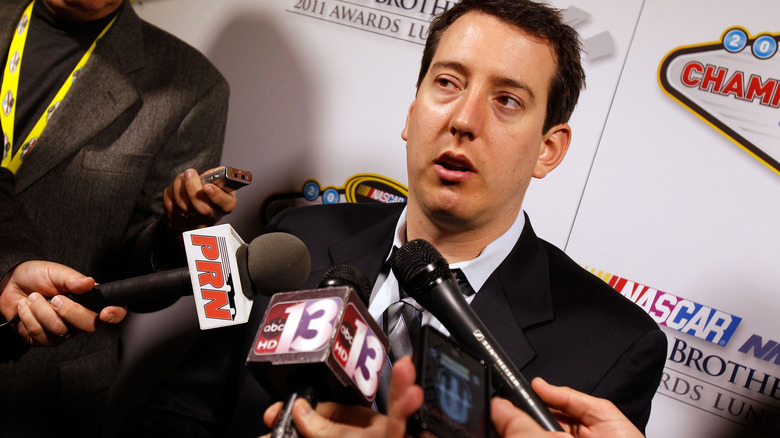 Kyle Busch talking to reporters in 2011