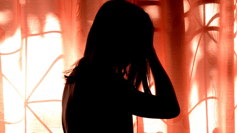 Silhouette of a crying woman