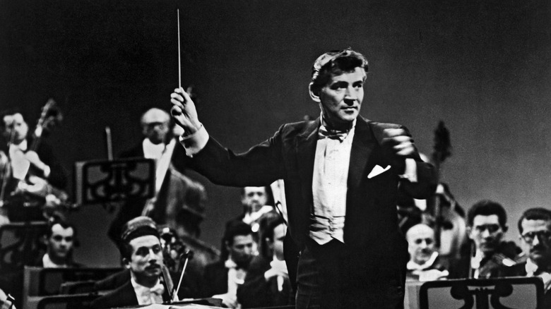 Leonard Bernstein conducting baton raised