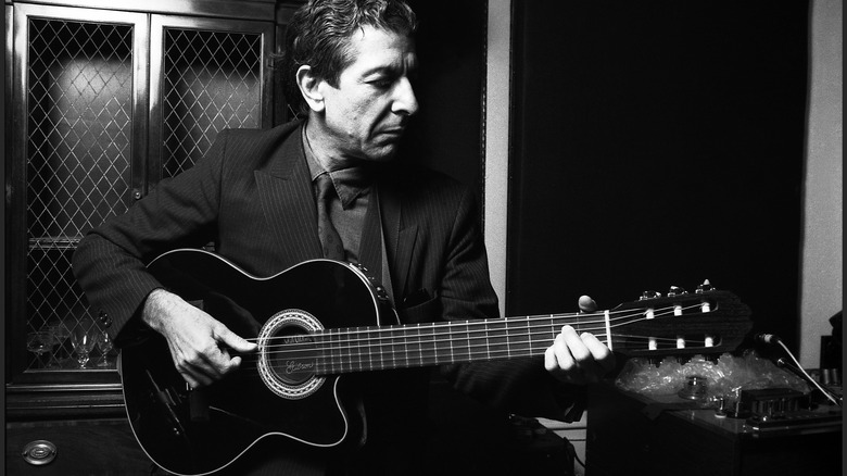 Leonard Cohen playing guitar in the 80s
