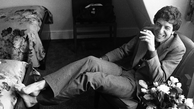 Leonard Cohen smiling and smoking