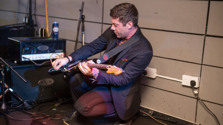 Wes Borland playing guitar in studio