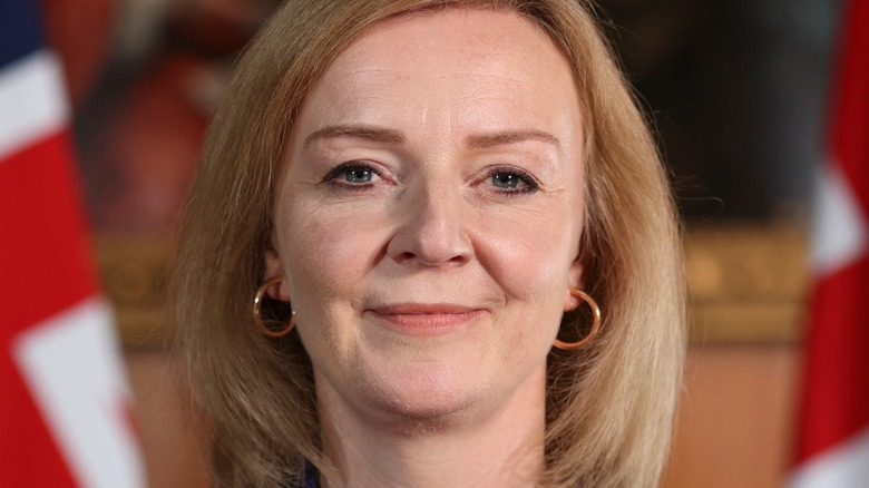 Liz Truss in front of union flags