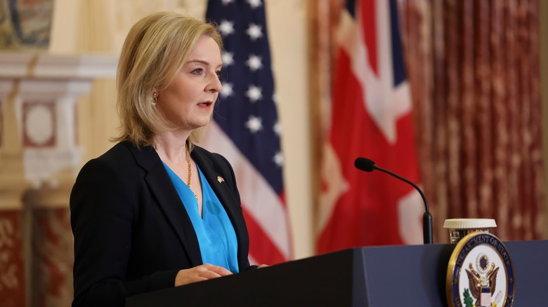 Liz Truss at a podium