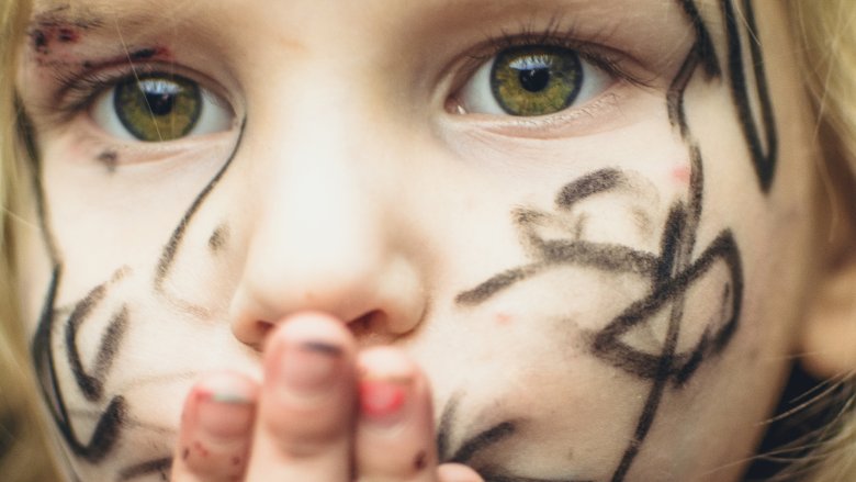 Child covered with marker