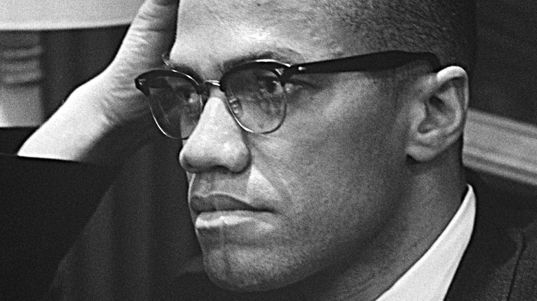 malcolm x hand on head