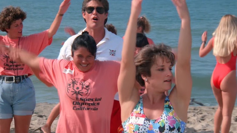 Retton leads stretches on the beach 