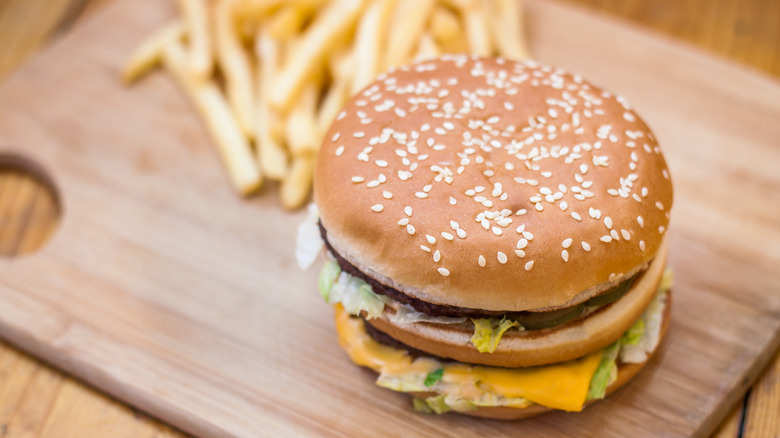 mcdonald's burger and fries on wooden board