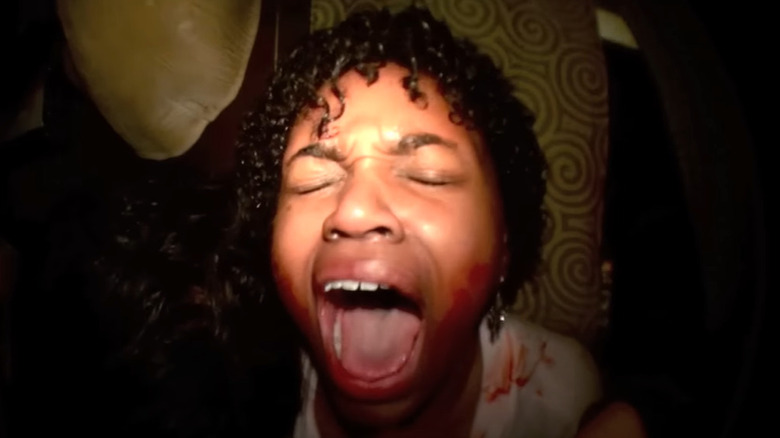 Woman screaming while being tortured