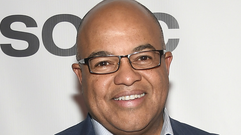 Mike Tirico smiling