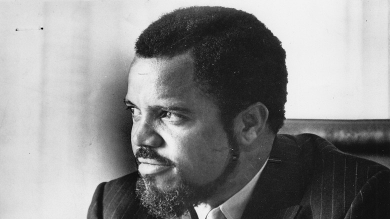 Berry Gordy looks to his right