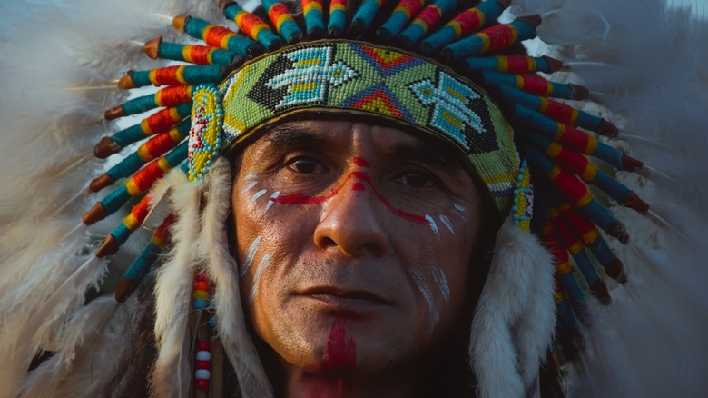American Indian man wearing war bonnet