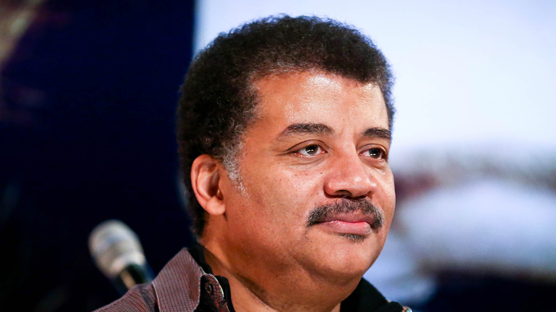 Neil deGrasse Tyson looking off