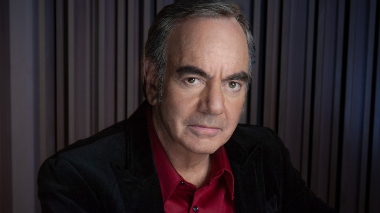 neil diamond red shirt staring at camera