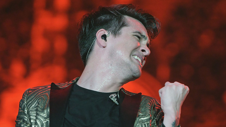 Brendon Urie making a fist on stage