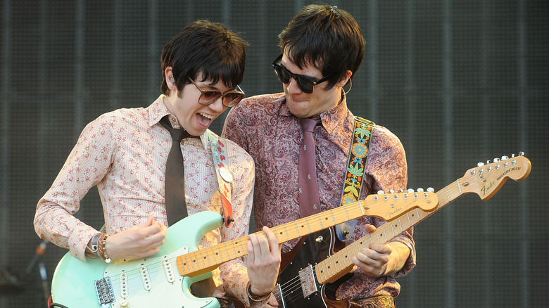 Ryan Ross Brendon Urie playing guitar